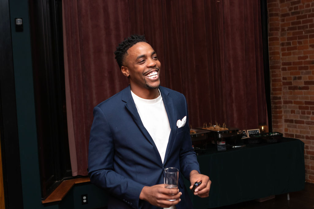 Tinashe Chaponda smiling at a Project 30 event.